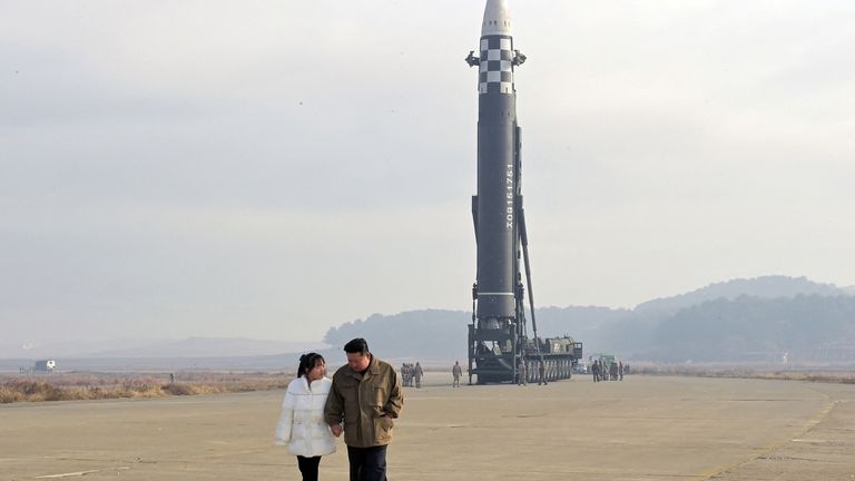 North Korean leader Kim Jong Un, along with his daughter, walks away from an intercontinental ballistic missile (ICBM) in this undated photo released on November 19, 2022 by North Korea's Korean Central News Agency (KCNA). KCNA via REUTERS ATTENTION EDITORS - THIS IMAGE WAS PROVIDED BY A THIRD PARTY. NO THIRD PARTY SALES. SOUTH KOREA OUT. NO COMMERCIAL OR EDITORIAL SALES IN SOUTH KOREA. REUTERS IS UNABLE TO INDEPENDENTLY VERIFY THIS IMAGE.
